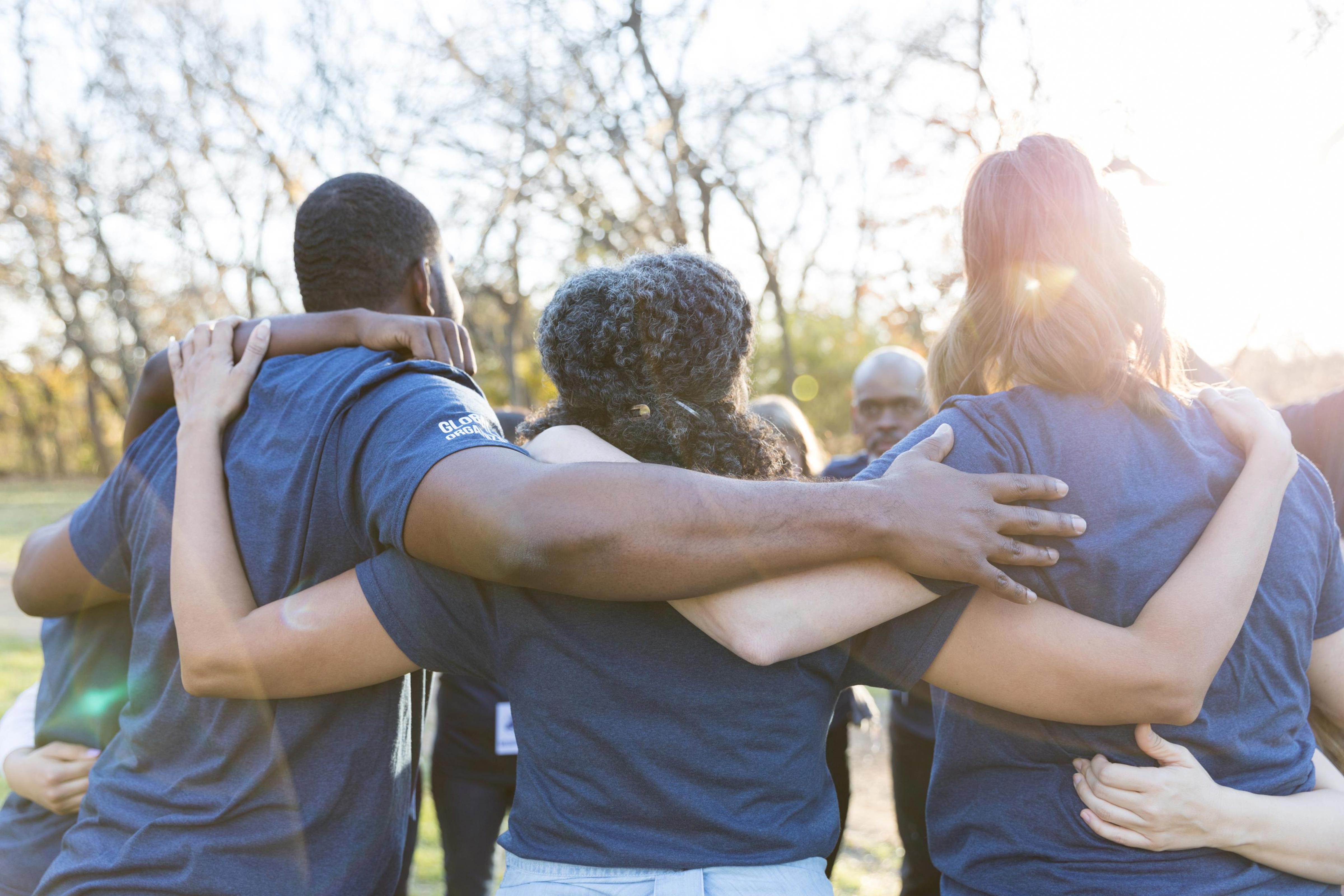 volunteers hugging_Drees