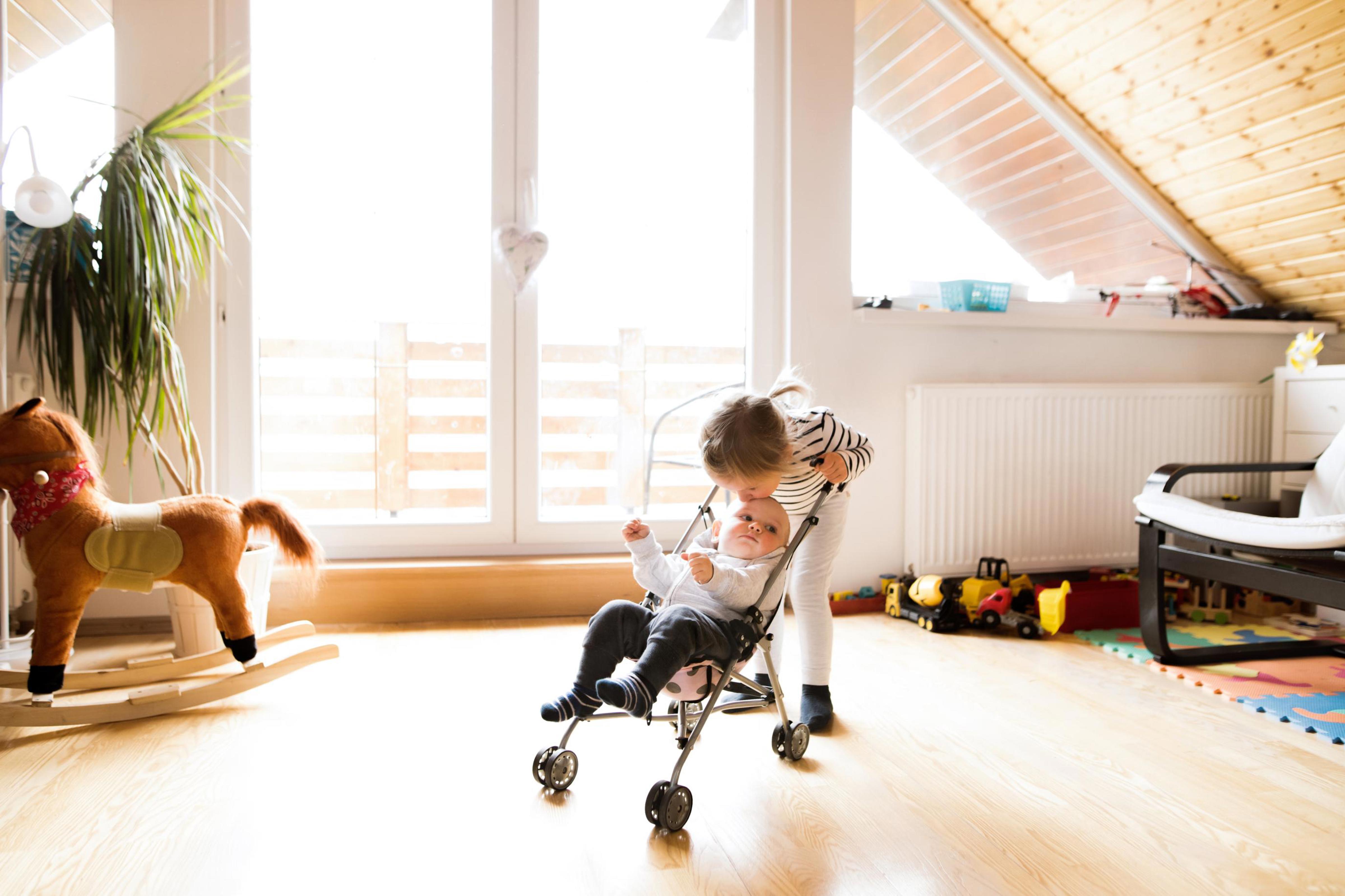 young girl and baby stroller_Drees